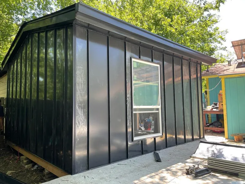 Black standing seam metal wall panels for Metal Roof Installation in Newberry